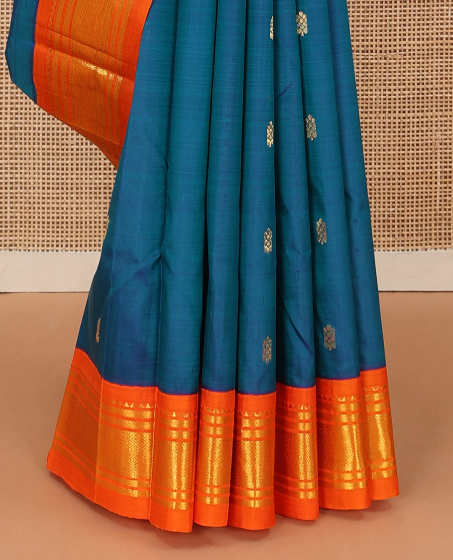 Blue zari buttas Kanchipuram silk saree, contrast one-sided korvai border of rekku, banaras, and mayil kann, and zari design pallu