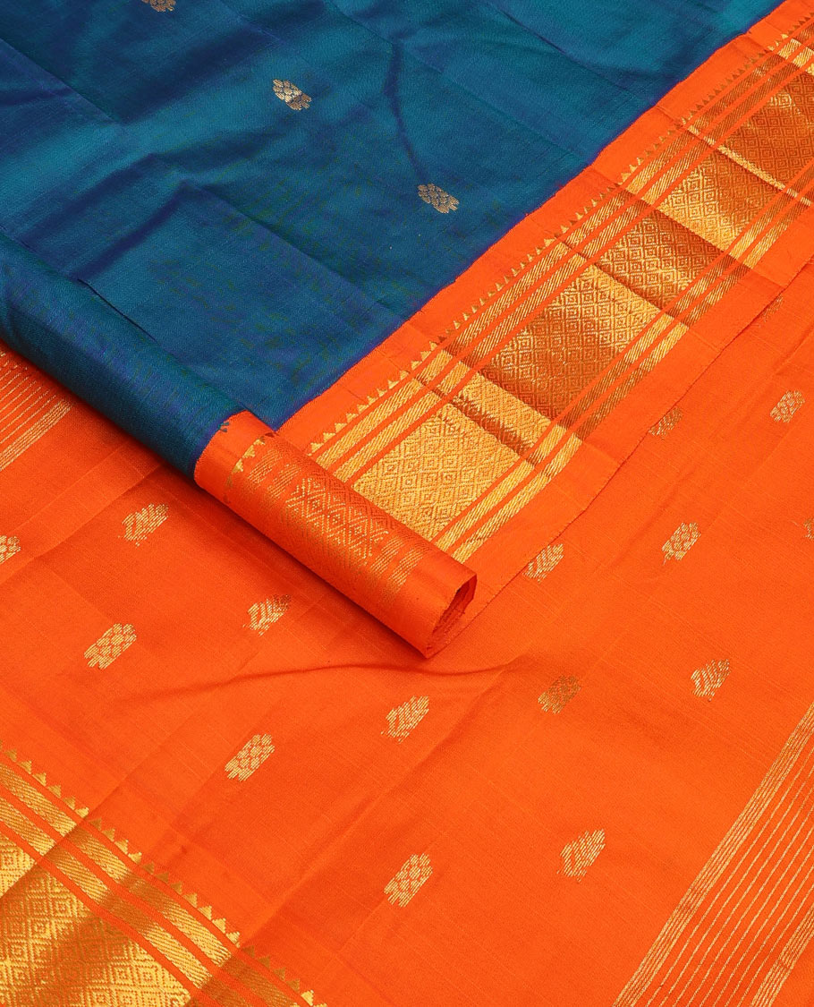 Blue zari buttas Kanchipuram silk saree, contrast one-sided korvai border of rekku, banaras, and mayil kann, and zari design pallu