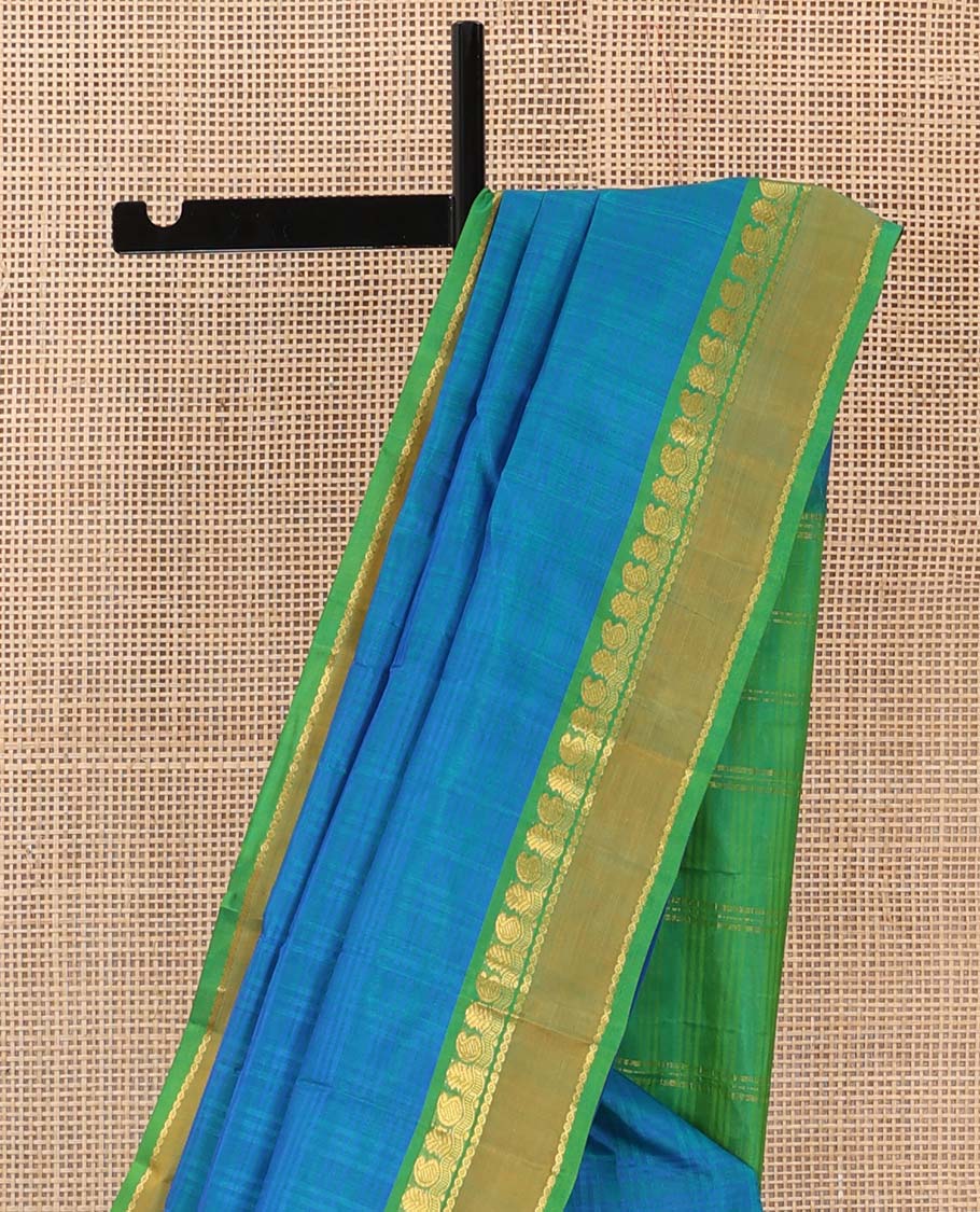 Blue checked Kanchipuram silk saree, contrast rettai pettu border of manga, neli, and diamond designs, and striped pallu