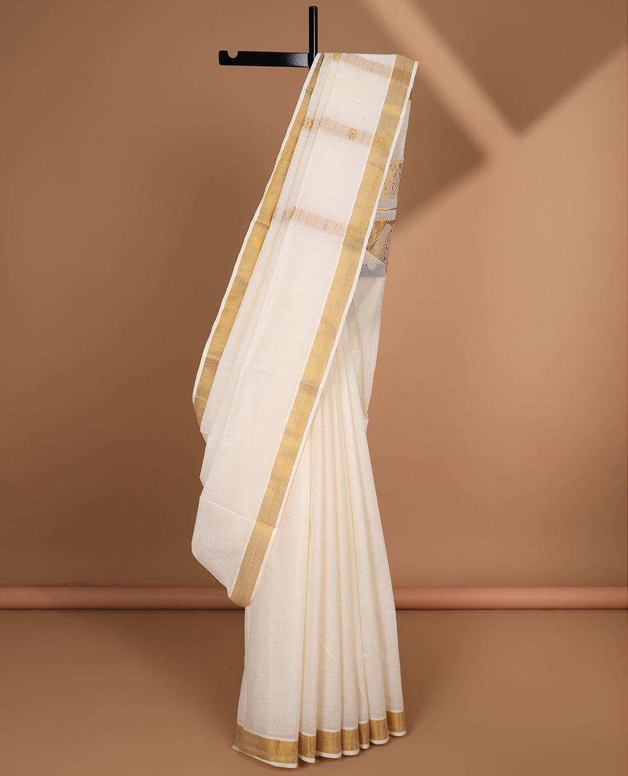 Cream kerala saree with zari designs, plain border & pallu of intricate designs