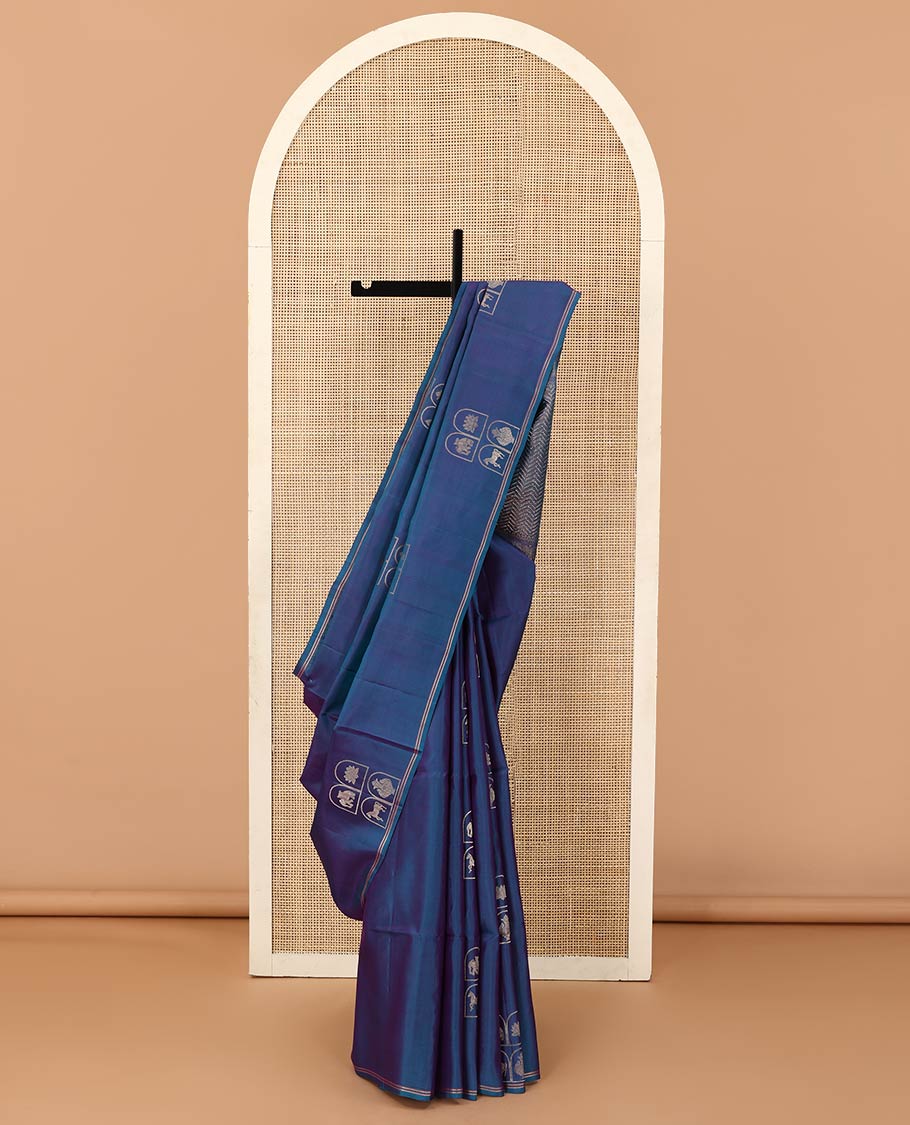Borderless blue kuthirai, kamalam, yaanai, and Kumbha enclosed Mughal arches soft silk saree, pallu of chevron designs