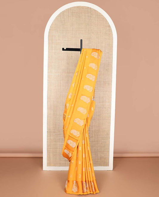 Orange floral motifs mushru silk saree with self floral design border & argyle design pallu