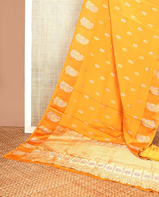Orange floral motifs mushru silk saree with self floral design border & argyle design pallu