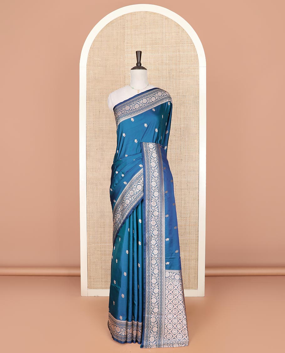 Blue floral buttas mushru silk saree, floral-creeper design zari border, and jaal pallu