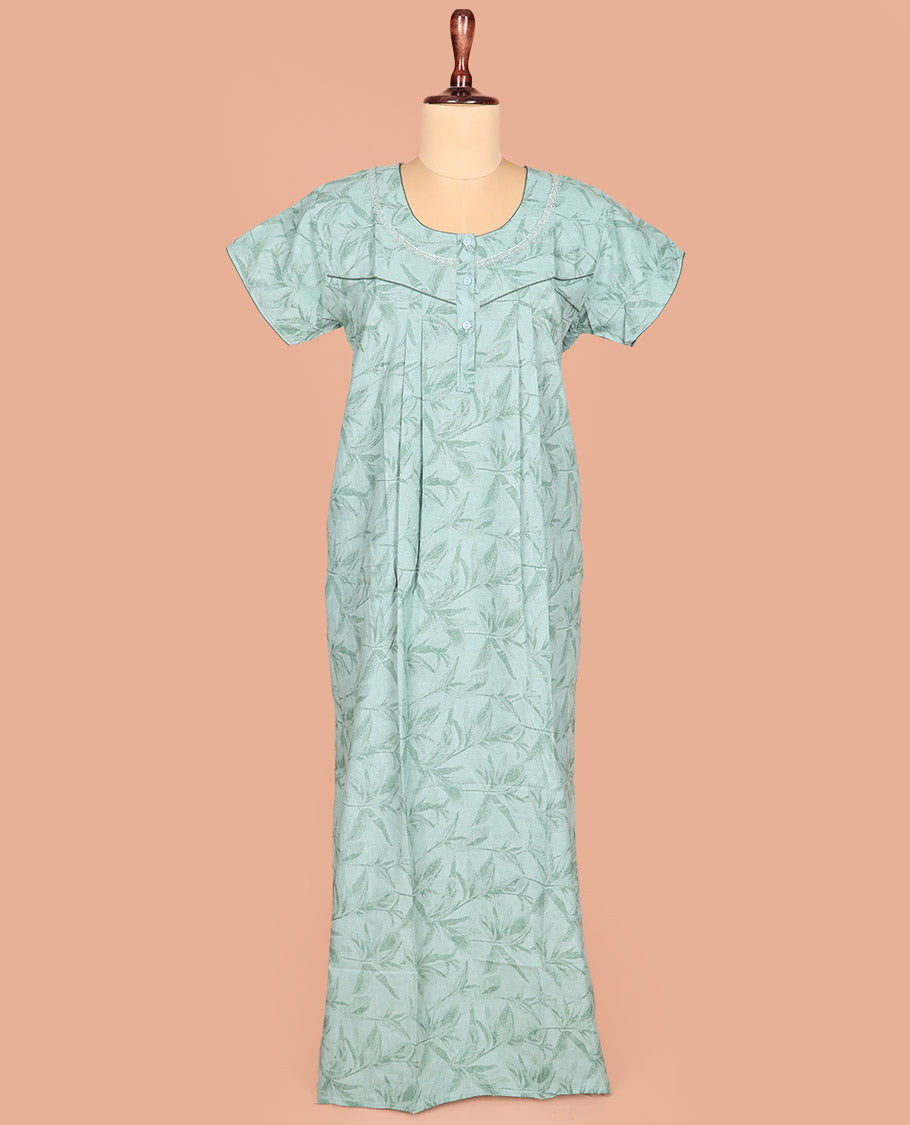 Green-Shade Cotton Nighty Subtly Adorned with Floral Patterns Print, Featuring Lace Work, Round Front Neck, and Half Sleeves