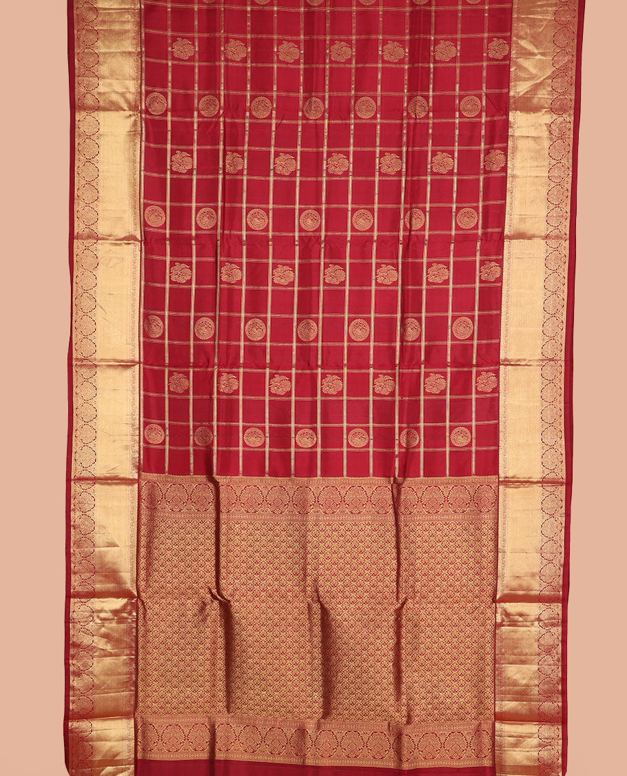 Light maroon butta enclosed checked nine-yard silk saree, traditional zari border, and pallu of intricate designs