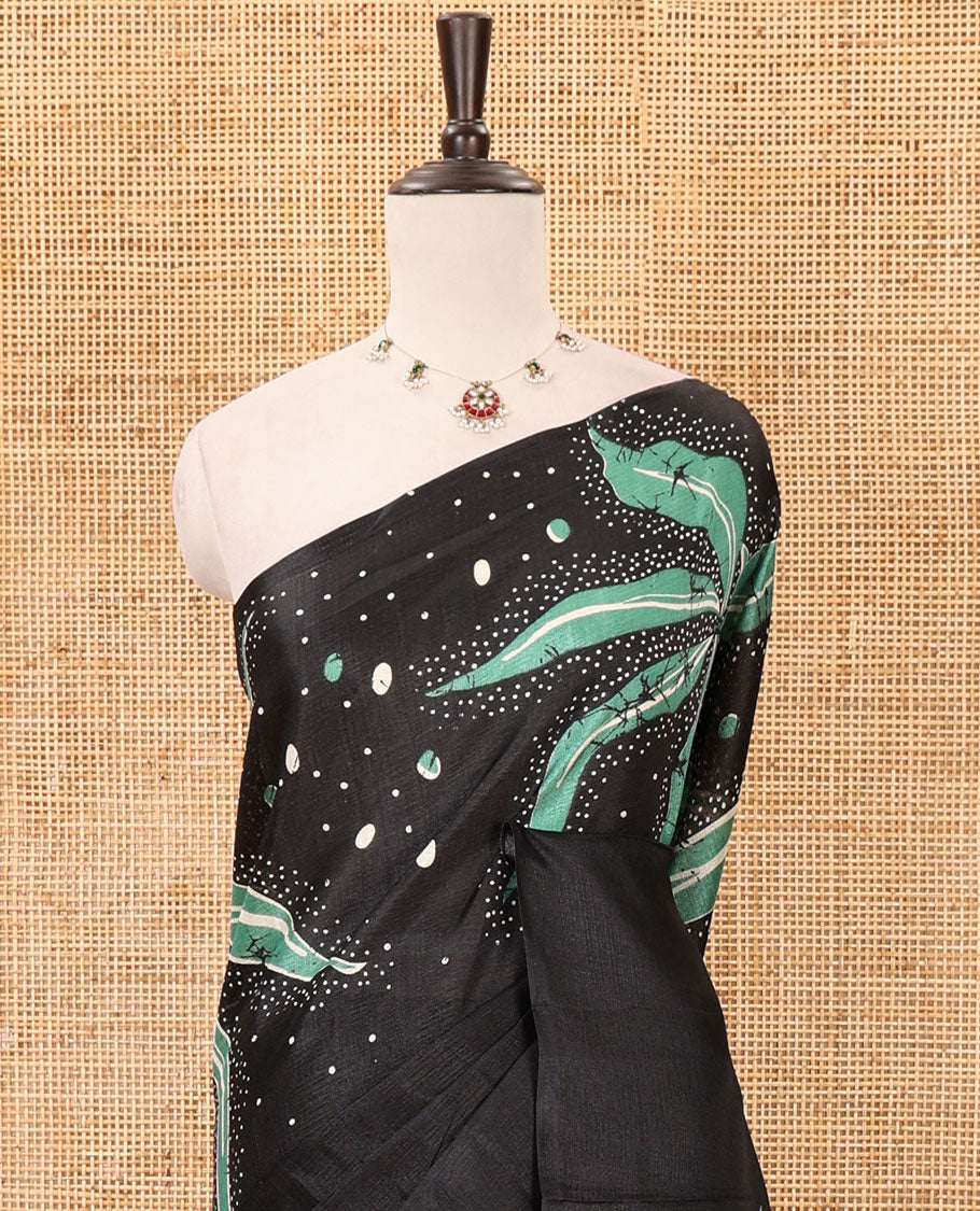 Black-base plain body khadi cotton saree with batik-style green-color floral & dots printed on its border & pallu, plain black blouse