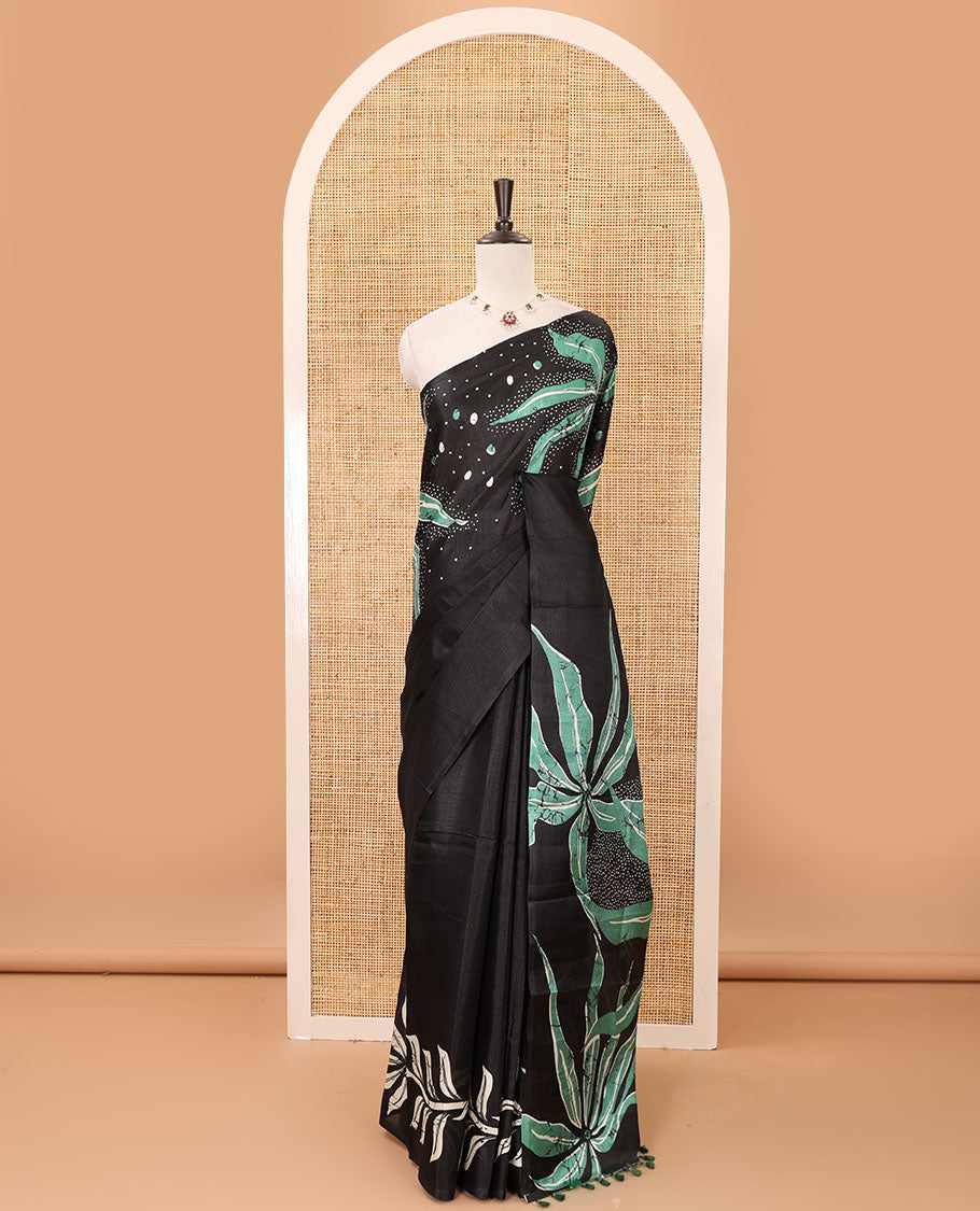 Black-base plain body khadi cotton saree with batik-style green-color floral & dots printed on its border & pallu, plain black blouse