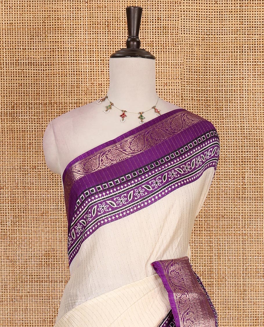 Cream-violet zari striped dola silk saree, contrast traditional zari border of leaf creeper, Ajrakh printed pallu, and Ajrakh printed blouse