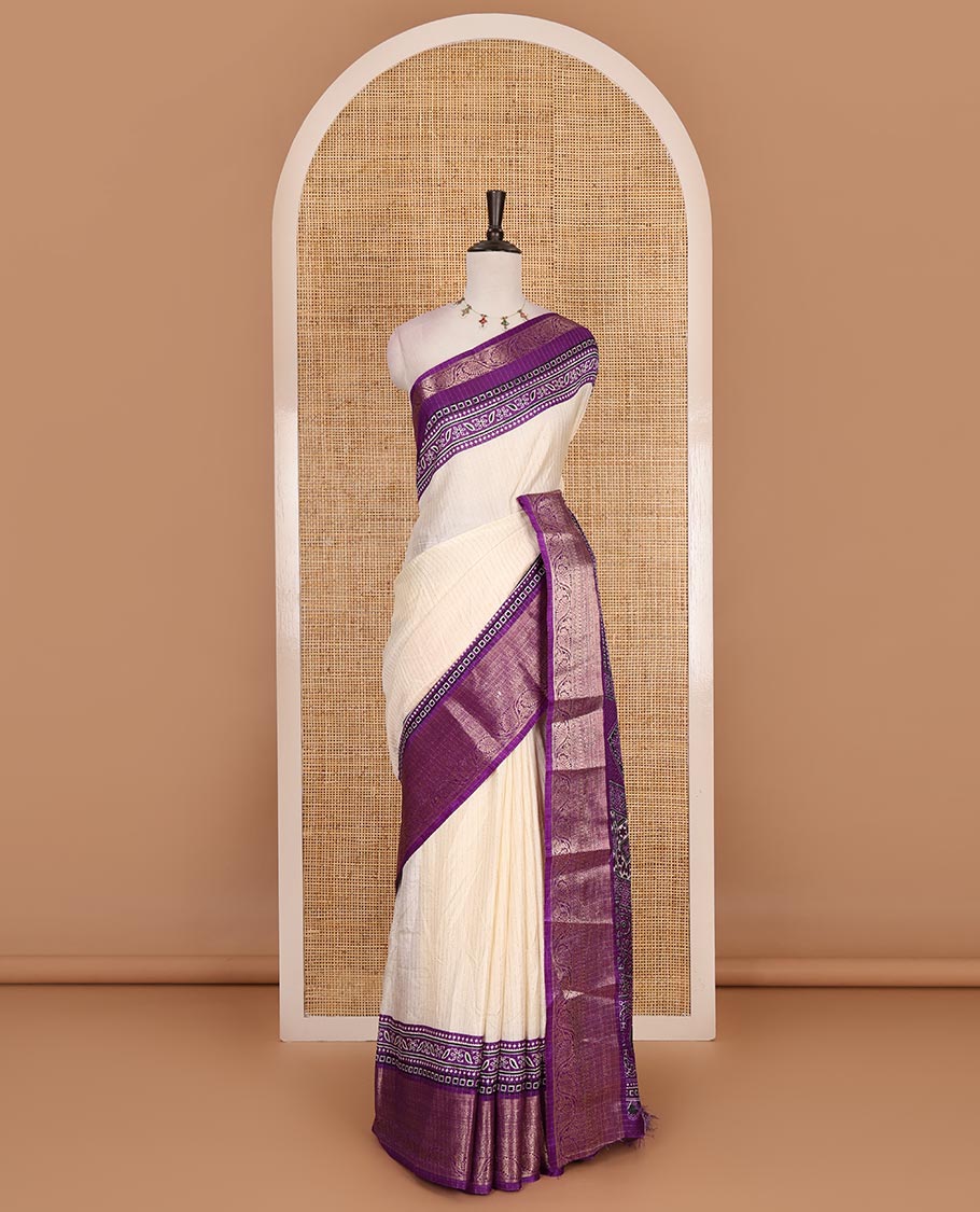 Cream-violet zari striped dola silk saree, contrast traditional zari border of leaf creeper, Ajrakh printed pallu, and Ajrakh printed blouse
