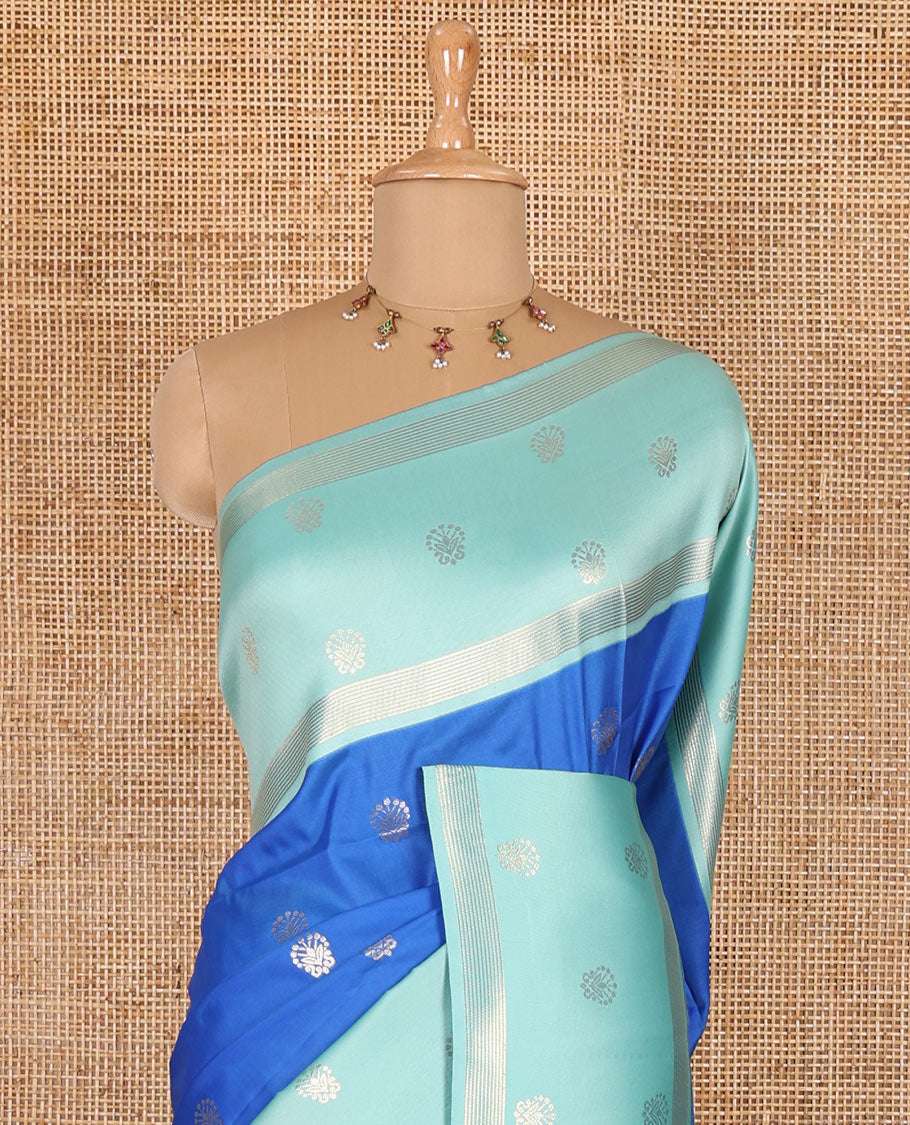Blue zari buttas soft silk saree, contrast zari border of intricate designs, zari-rich jaal pallu, and a contrast zari design blouse