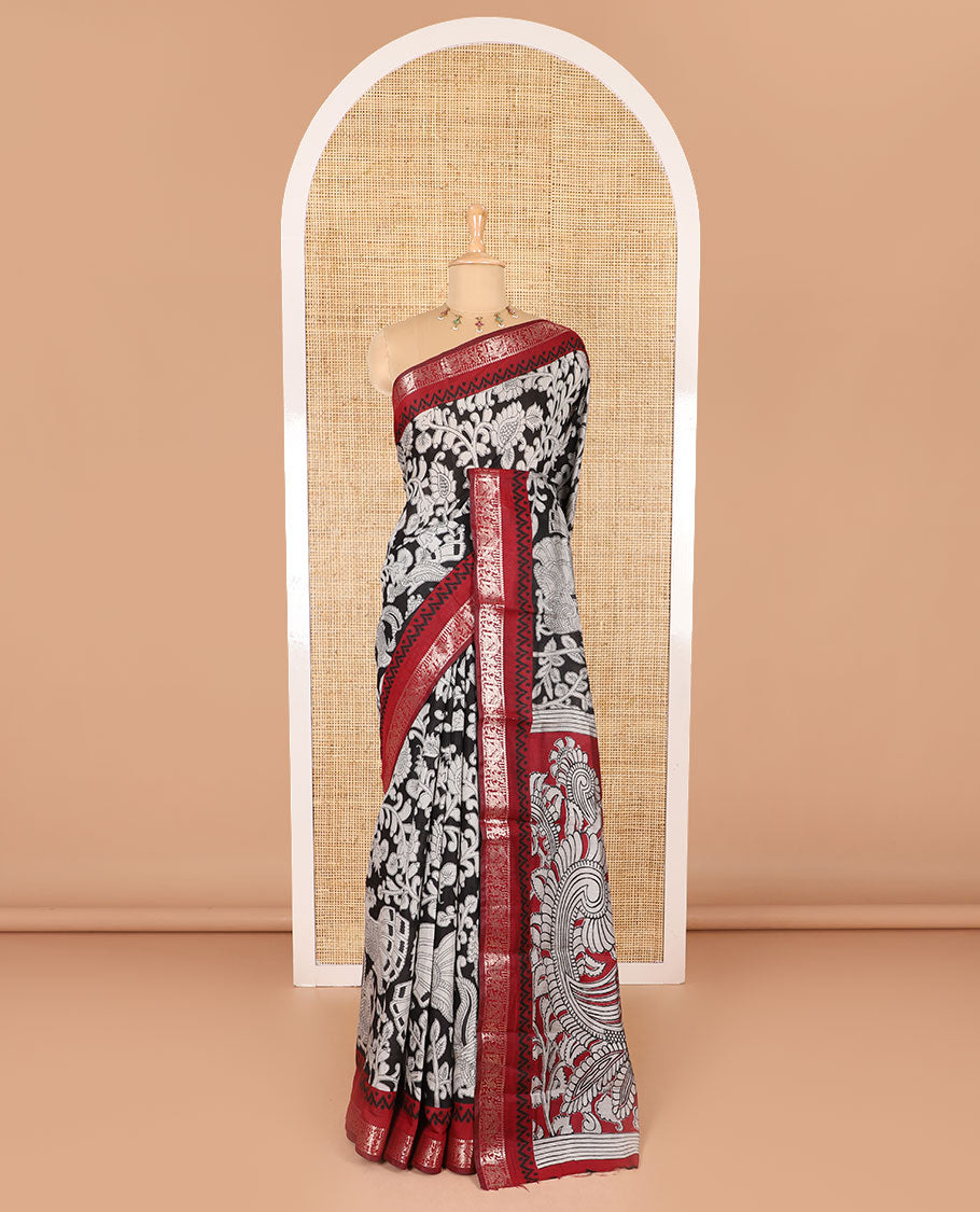 Black kalamkari floral vine and peacock printed muslin cotton saree, contrast zari border, kalamkari peacock printed pallu, and a contrast coin buttas printed blouse