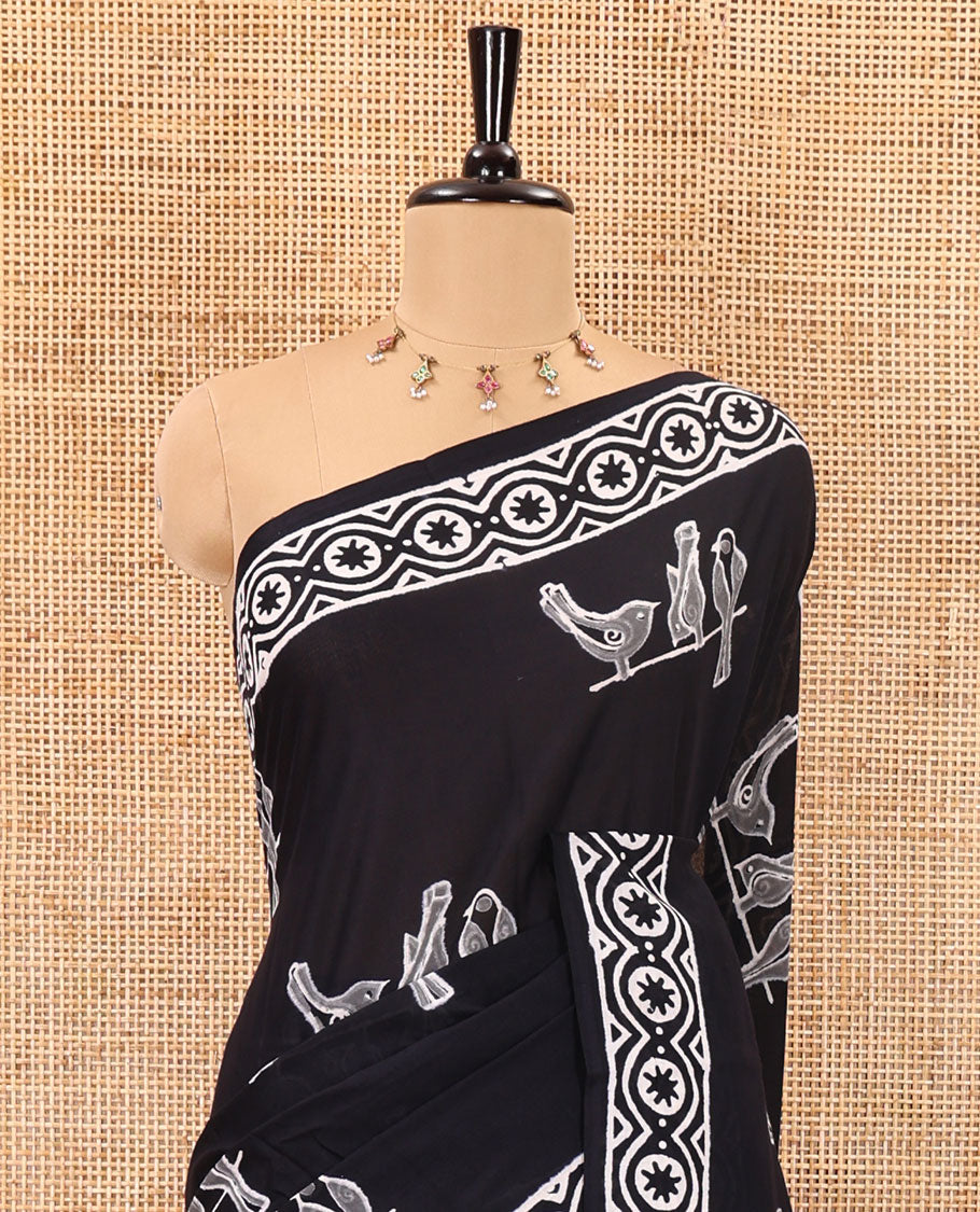 Black sparrow motifs hand block printed soft mul cotton, block printed border, pallu of floral-geometric print, and a hand block printed blouse