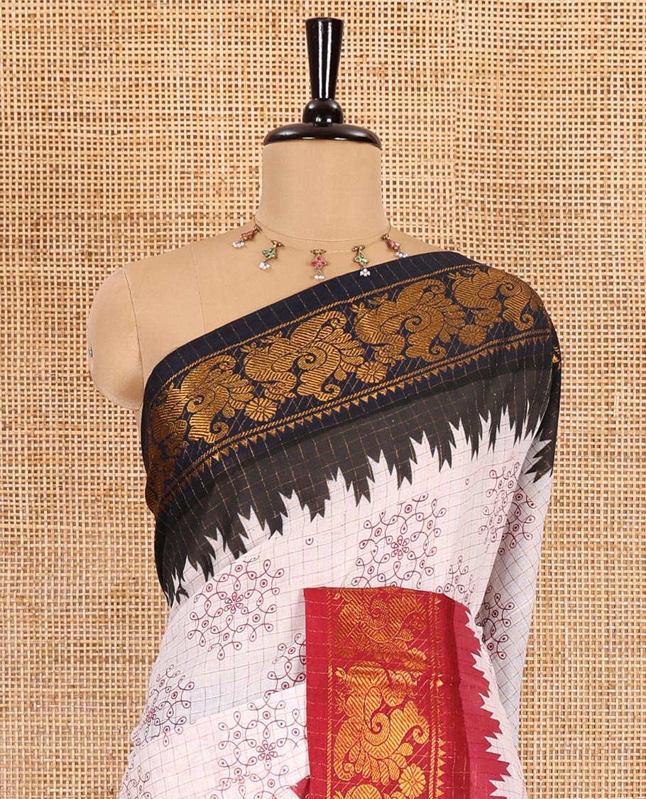 Cream gold zari checked and kolam motifs printed sungudi cotton saree, contrast ganga jamuna temple traditional zari border, zari striped pallu, and a contrast zari checked blouse