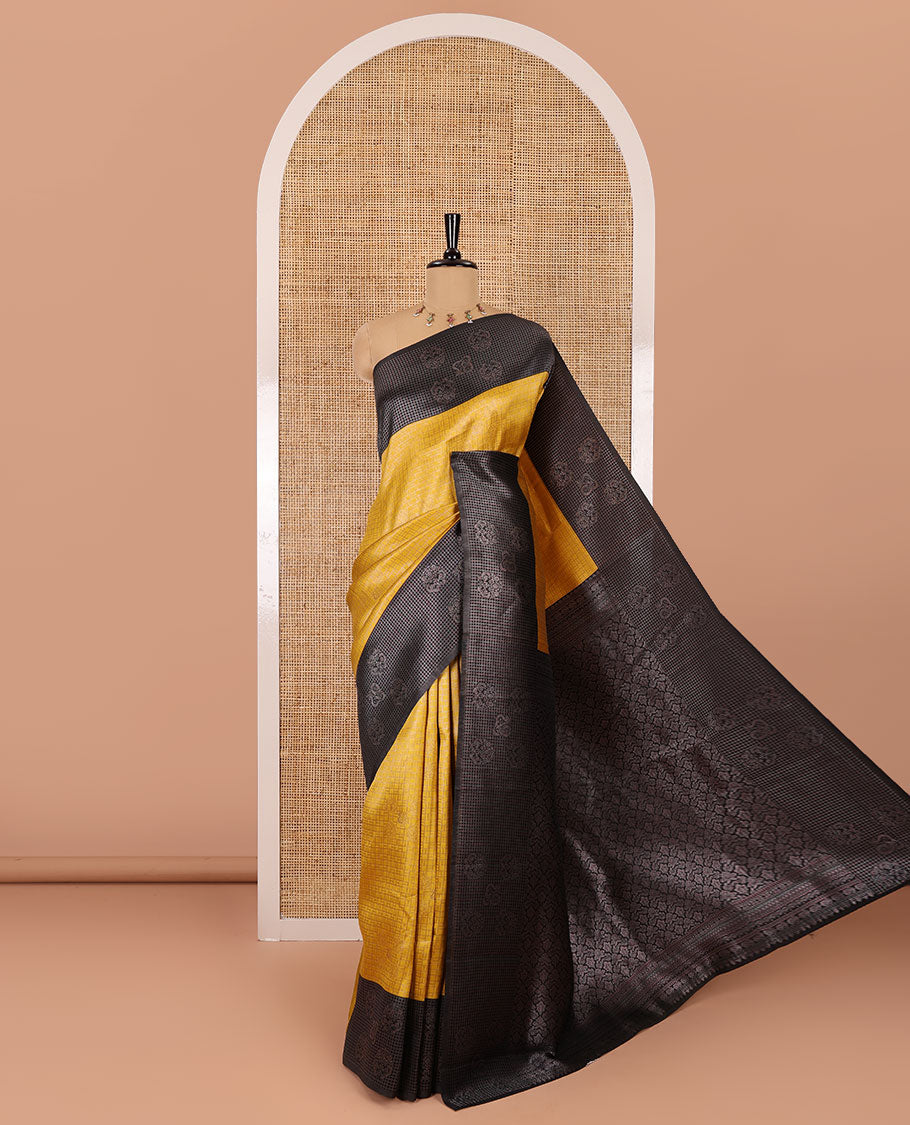 Yellow zari buttas and checked kanchi silk saree, contrast border of zari buttas, and checks, intricate pallu, and contrast zari bordered blouse