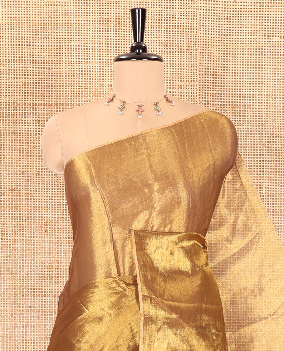 Borderless Gold plain khadi tissue saree self pallu with tassels and a matching blouse