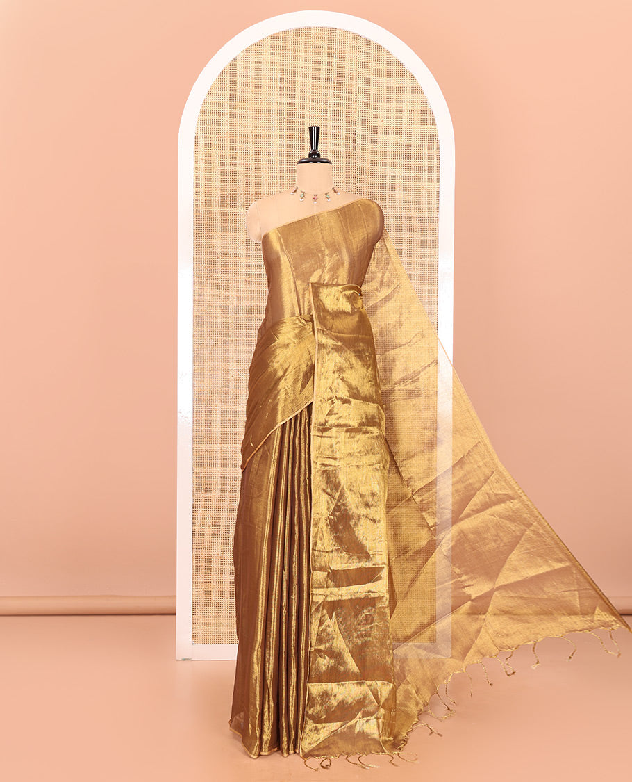 Borderless Gold plain khadi tissue saree self pallu with tassels and a matching blouse