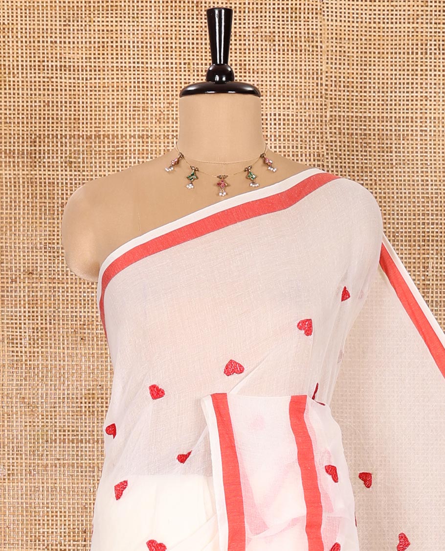 Cream Khadi Mul Cotton Saree Adorned with Heart Motifs Embroidery All Over Its Body, Self-Border, Pallu Steeped with Heart Motifs Embroidery, and Paired with a Matching Blouse