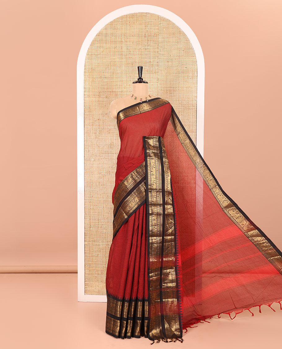 Maroon Plain Chettinad Cotton Saree Adorned with a Contrasting Temple Rettai Pettu Border of Peacock-Elephant Motifs, a Subtle Pallu of Stripes, and a Matching Blouse