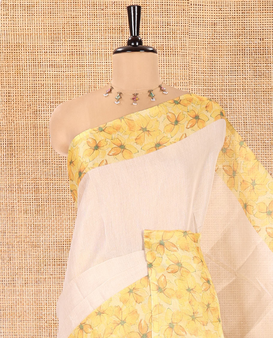 Cream Plain Tissue Saree, Artfully Designed with Contrast Floral Printed Border, Pallu Steeped with Flower Motifs Print, and Paired with a Contrast Blouse