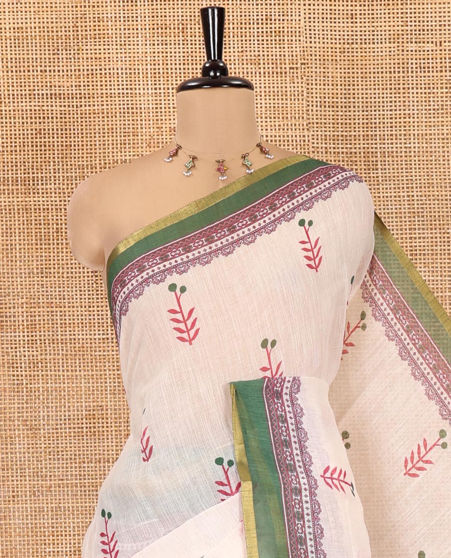 Cream-Green Linen Cotton Saree Features Floral Buttas, Contrast Printed Border, Intricate Pallu, and a Contrast Blouse