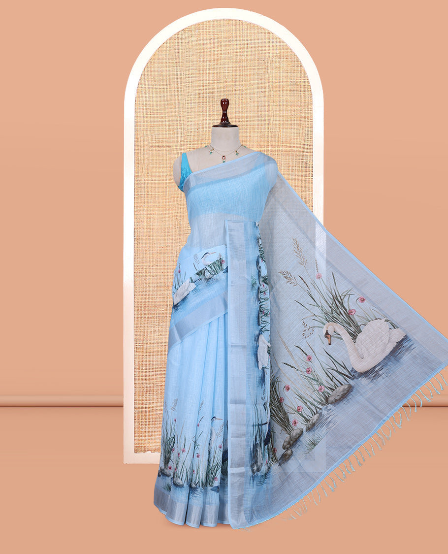 Blue Linen Cotton Saree, Accentuated with a Bird Print, a Subtle Zari Border, and a Matching Blouse