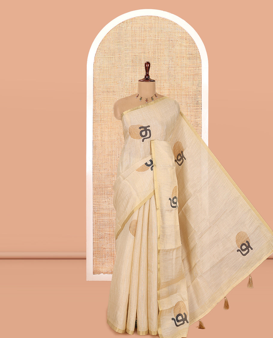 Gold Tissue Linen Saree Features Tamil Letter Print, a Piping Border, and a Matching Blouse