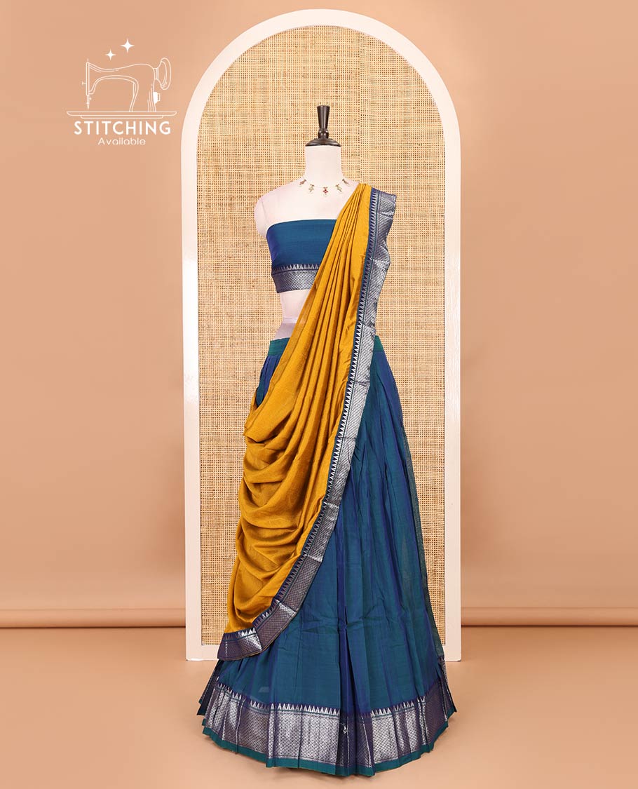 Royal blue Mercerised cotton half-saree, plain & contrast mayil kann temple border skirt, matching blouse & contrast zari border syska georgette dhavani
