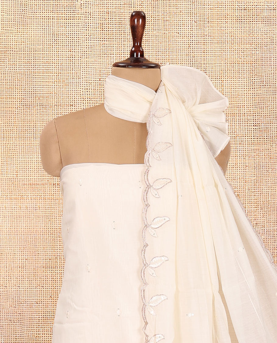 Cream Mul Chanderi Material Churidar Features a Floral Outline Embroidered Top, a Santoon Bottom, a Scallop Threadwork Dupatta