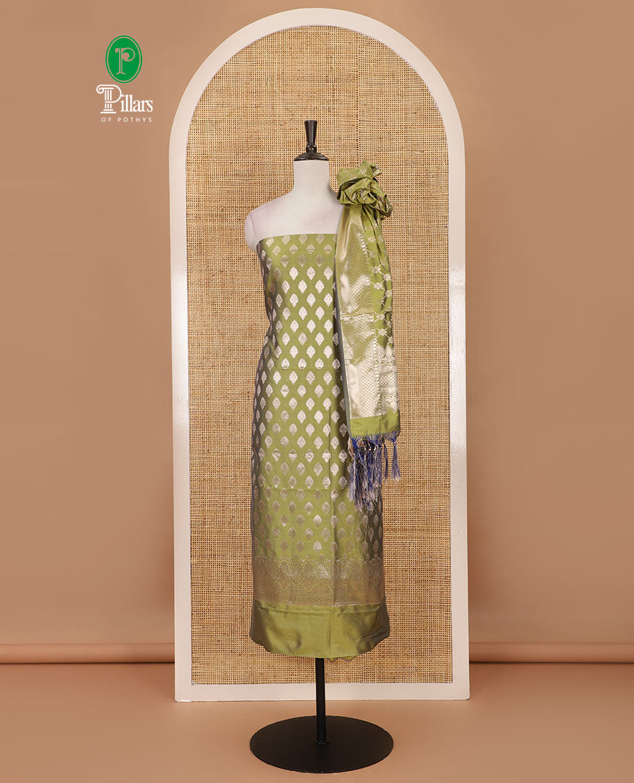 Green banarasi material chudidar set set, gold zari buttas woven top, plain bottom, and zari-rich jaal taffeta silk dupatta