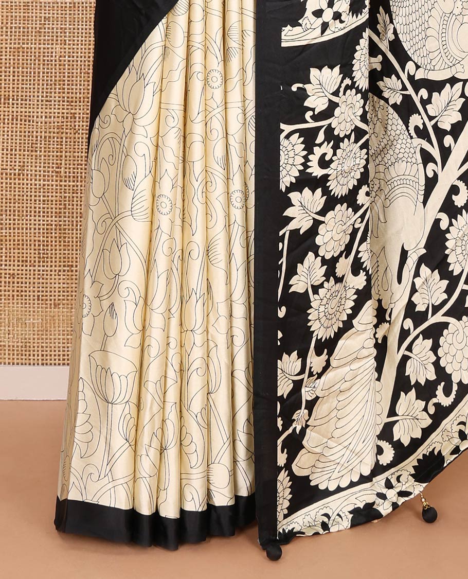 Chikku-black half-and-half plain and kalamkari floral printed satin crepe saree, plain border, pallu of floral vine and peacock printed, and kalamkari floral printed blouse