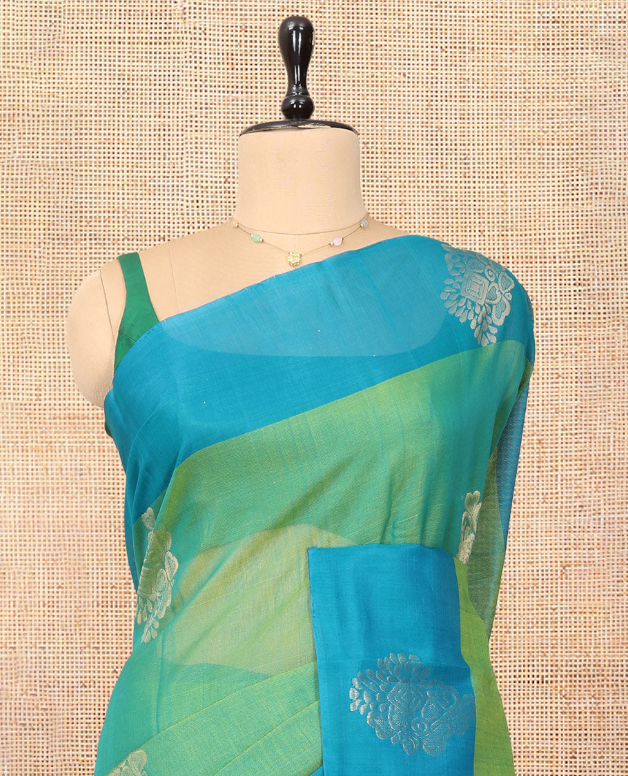 Green Cotton Saree, Accentuated with Zari Buttas, a Contrast Zari Butta Border, a Geometric Pallu, and a Contrast Blouse