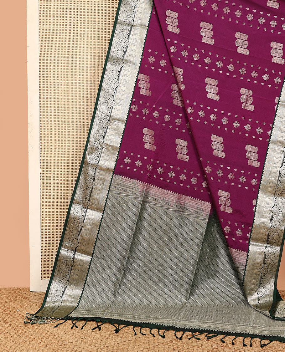 Purple geometric buttas soft silk saree, contrast traditional zari design border, and pallu of chevron designs