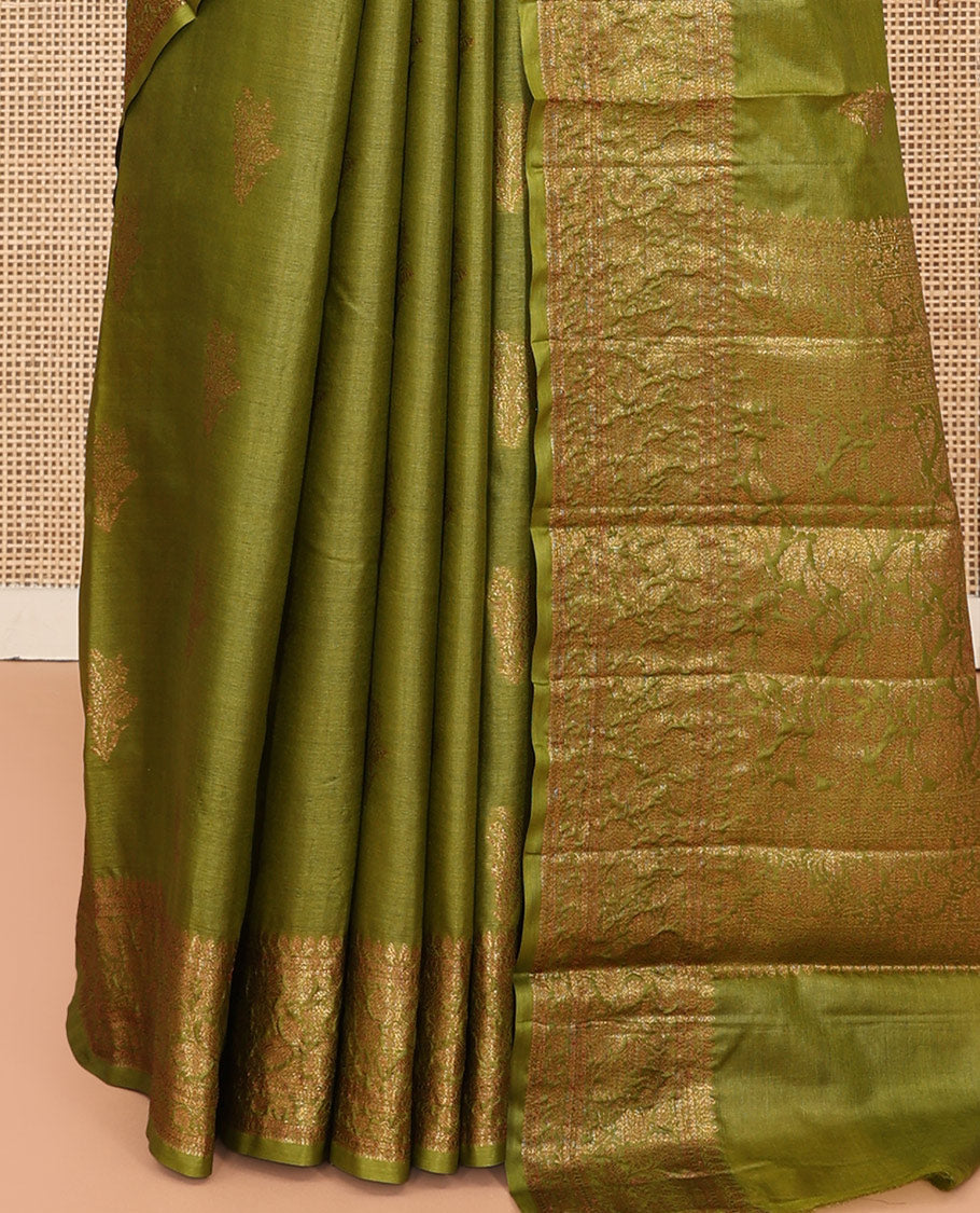 Green Tussar Silk Saree Features Zari Buttas, Highlighted by a Zari Border, Intricately Designed Pallu, and a Matching Blouse