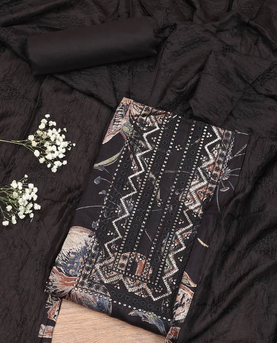 Black Material Chudidar Set, Decked Up with Floral Printed and Neck Embroidered Rayon Top, a Plain Rayon Bottom, and Paired with Floral Vine Embroidered Dupatta