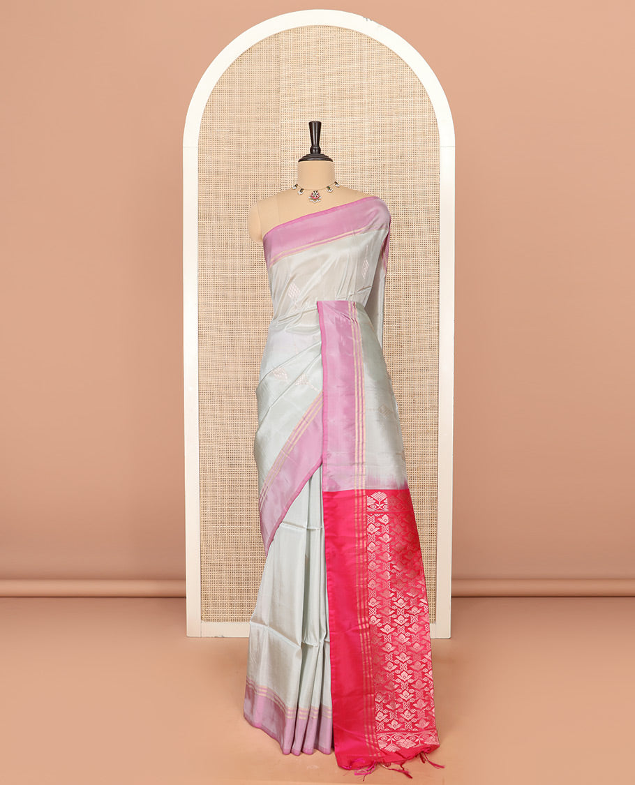 Grey Semi Uppada Saree Embellished with Zari Buttas, Complemented by a Contrast Bavanji Border, Pallu Elevated with Intricate Zari Designs, and Paired with a Contrast Blouse