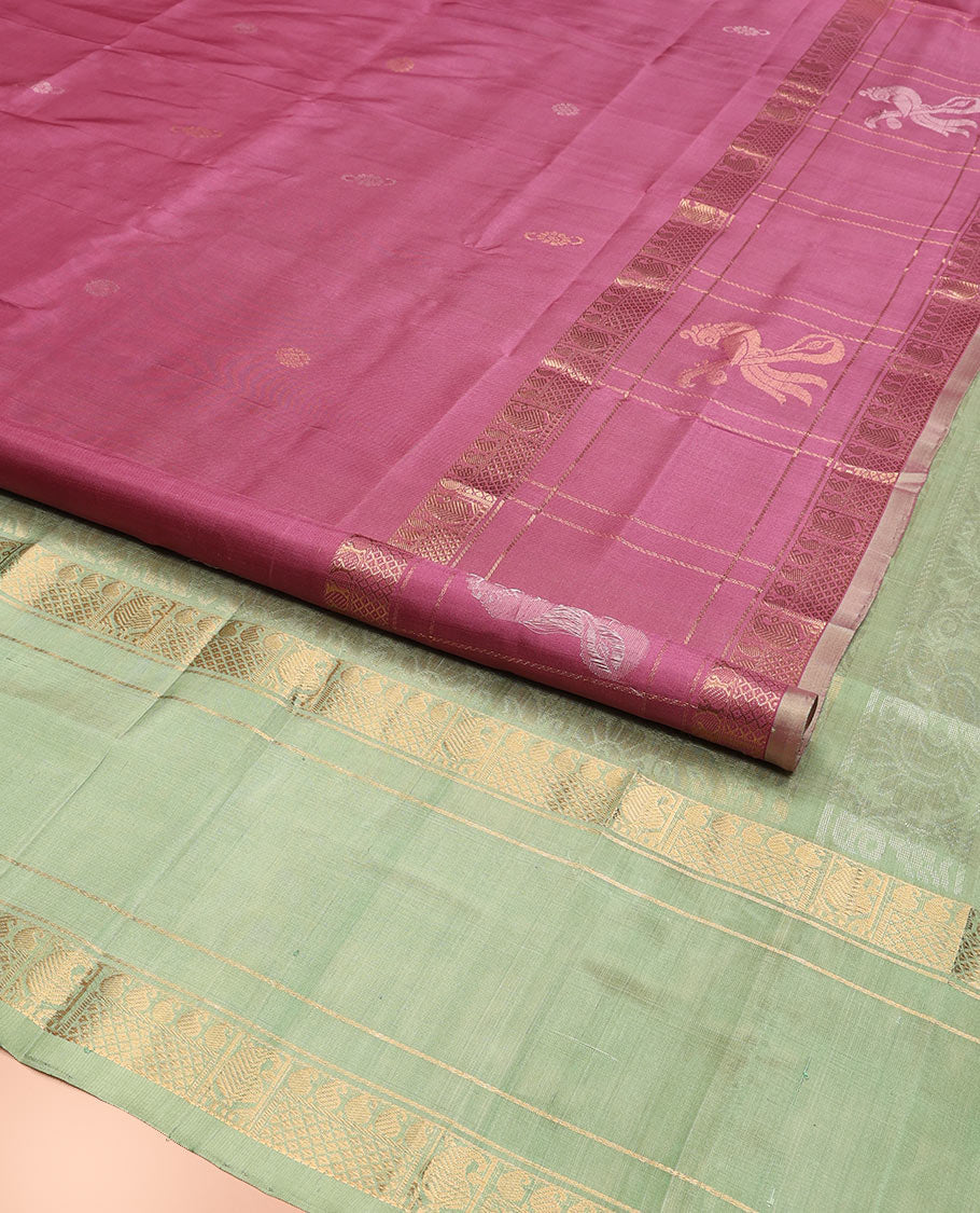 Onion Pink Uppada Silk Saree Elevated with Floral Buttas, Captivating Contrast Border of Traditional Zari Motifs and Peacock Motifs, Pallu Depicting Floral Jaal Design, and Paired with a Contrast Zari-Bordered Blouse