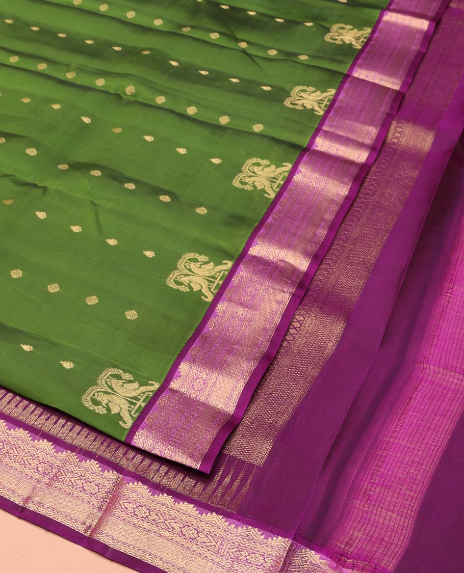 Green Vasundhara Lite-Silk Mix Saree Embellished with Zari Buttas on Its Body, Complemented by a Contrast Border of Thazampoo Rekku, Rettai Neli, Jada Nagam, and Mayil Kann Designs, Gleaming Zari Pallu of Jaal Designs, and Paired with a Contrast Blouse