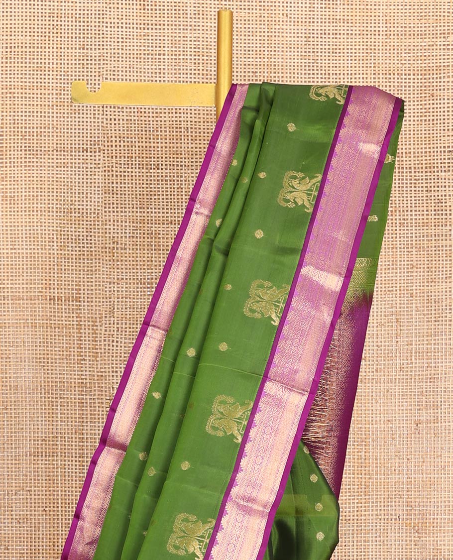 Green Vasundhara Lite-Silk Mix Saree Embellished with Zari Buttas on Its Body, Complemented by a Contrast Border of Thazampoo Rekku, Rettai Neli, Jada Nagam, and Mayil Kann Designs, Gleaming Zari Pallu of Jaal Designs, and Paired with a Contrast Blouse