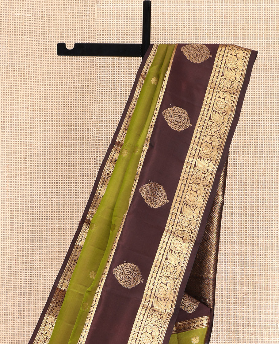 Green Vasundhara Lite Silk Mix Saree, Woven with Zari Buttas, Complemented by a Contrast Border of Muthu, Banaras, Rudraksham, and Mayil Designs, Pallu Elevated with Rudraksham Butta Enclosed Jaal Designs, and Paired with a Contrast Blouse