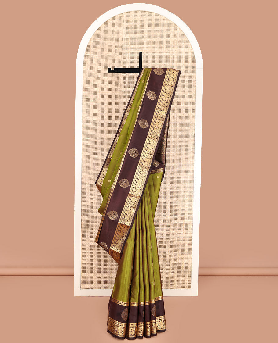 Green Vasundhara Lite Silk Mix Saree, Woven with Zari Buttas, Complemented by a Contrast Border of Muthu, Banaras, Rudraksham, and Mayil Designs, Pallu Elevated with Rudraksham Butta Enclosed Jaal Designs, and Paired with a Contrast Blouse