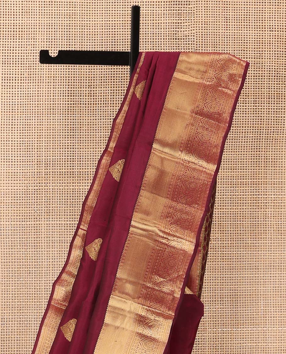 Maroon zari buttas Vasundhara silk mix saree, zari border of rekku, rudraksham,vanki, and thilakam designs, and manga motifs steeped pallu