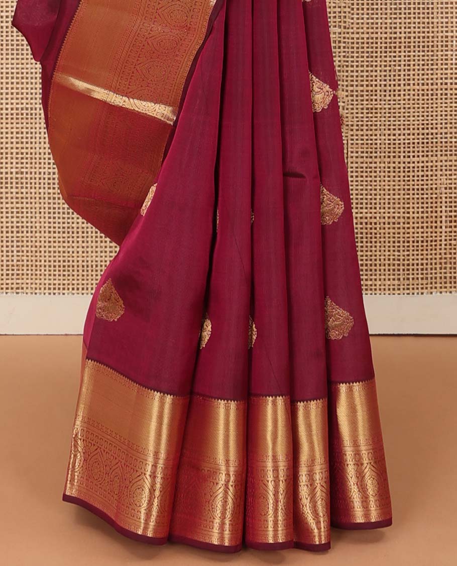 Maroon zari buttas Vasundhara silk mix saree, zari border of rekku, rudraksham,vanki, and thilakam designs, and manga motifs steeped pallu