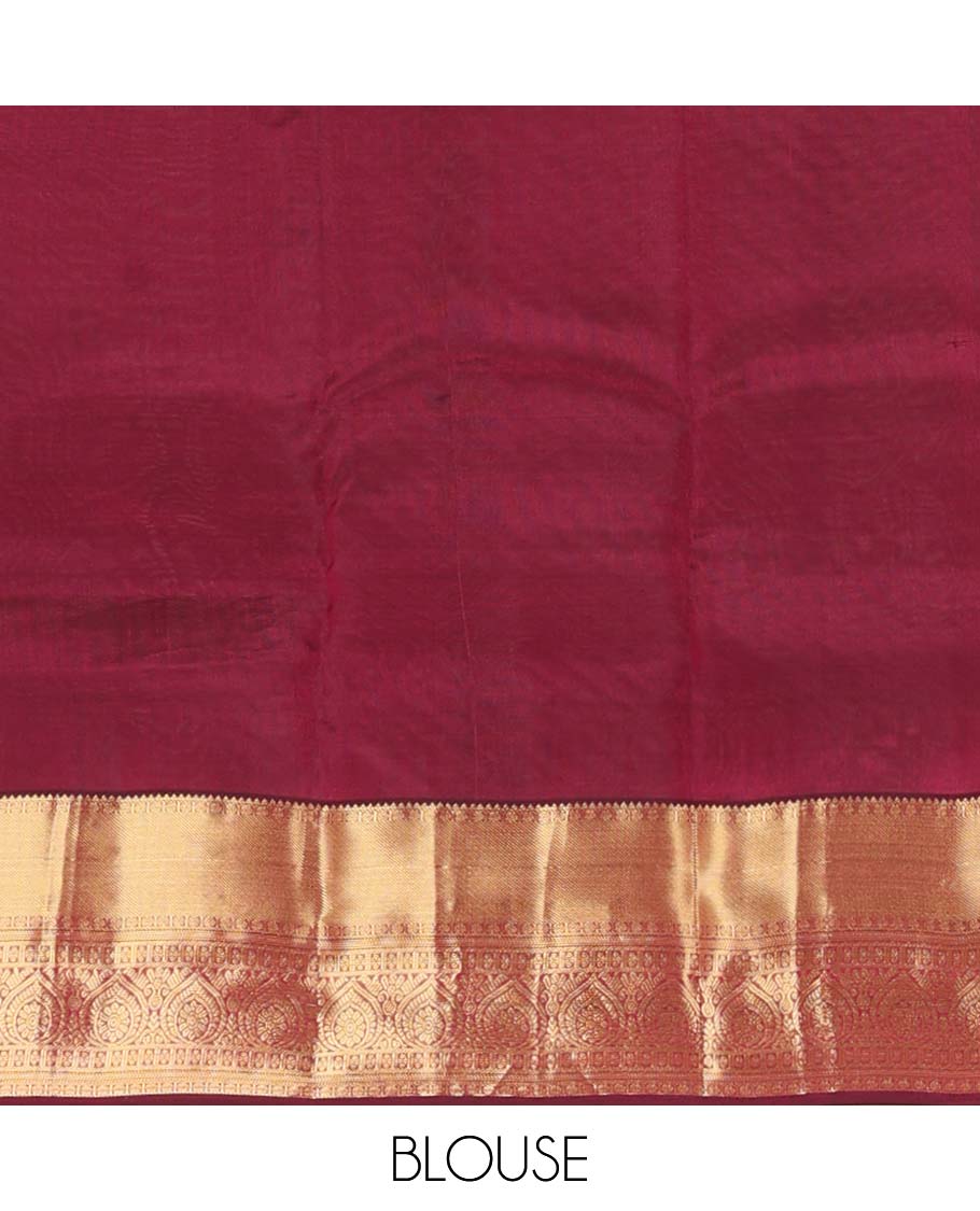 Maroon zari buttas Vasundhara silk mix saree, zari border of rekku, rudraksham,vanki, and thilakam designs, and manga motifs steeped pallu