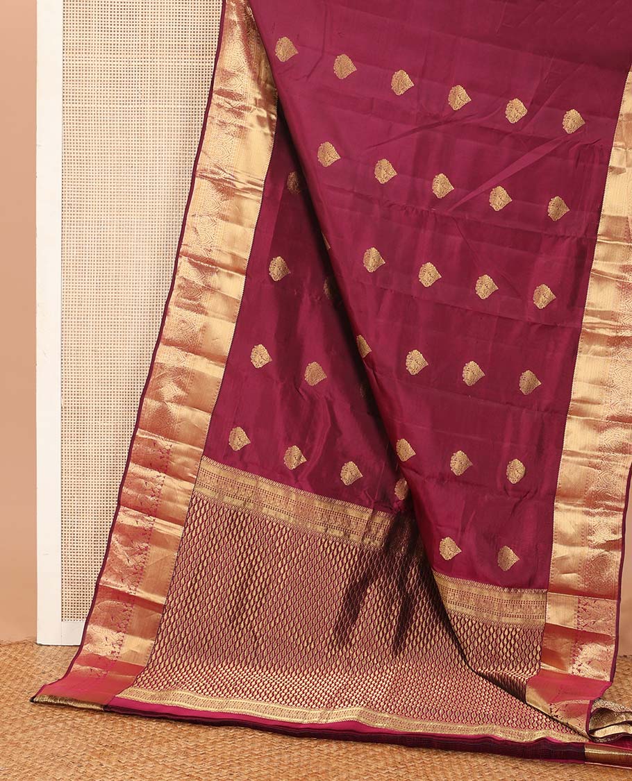 Maroon zari buttas Vasundhara silk mix saree, zari border of rekku, rudraksham,vanki, and thilakam designs, and manga motifs steeped pallu