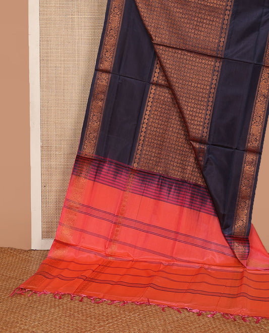 Blue jacquard banana pith saree, traditional zari border, and contrast striped pallu