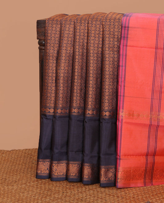 Blue jacquard banana pith saree, traditional zari border, and contrast striped pallu