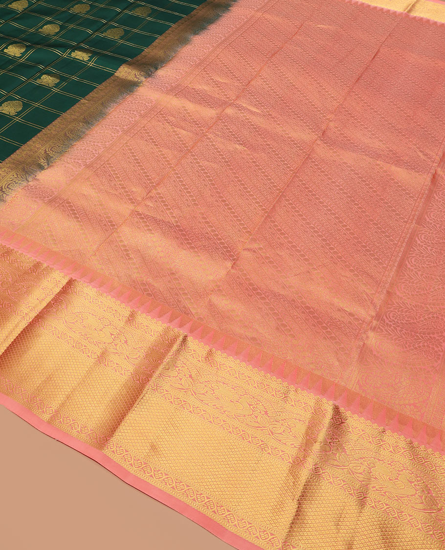 Green butta enclosed zari checked silk saree, contrast temple border of thilakam mokku, muthu, kodi visiry, mayil, and mayil kann designs, and geometric patterned pallu