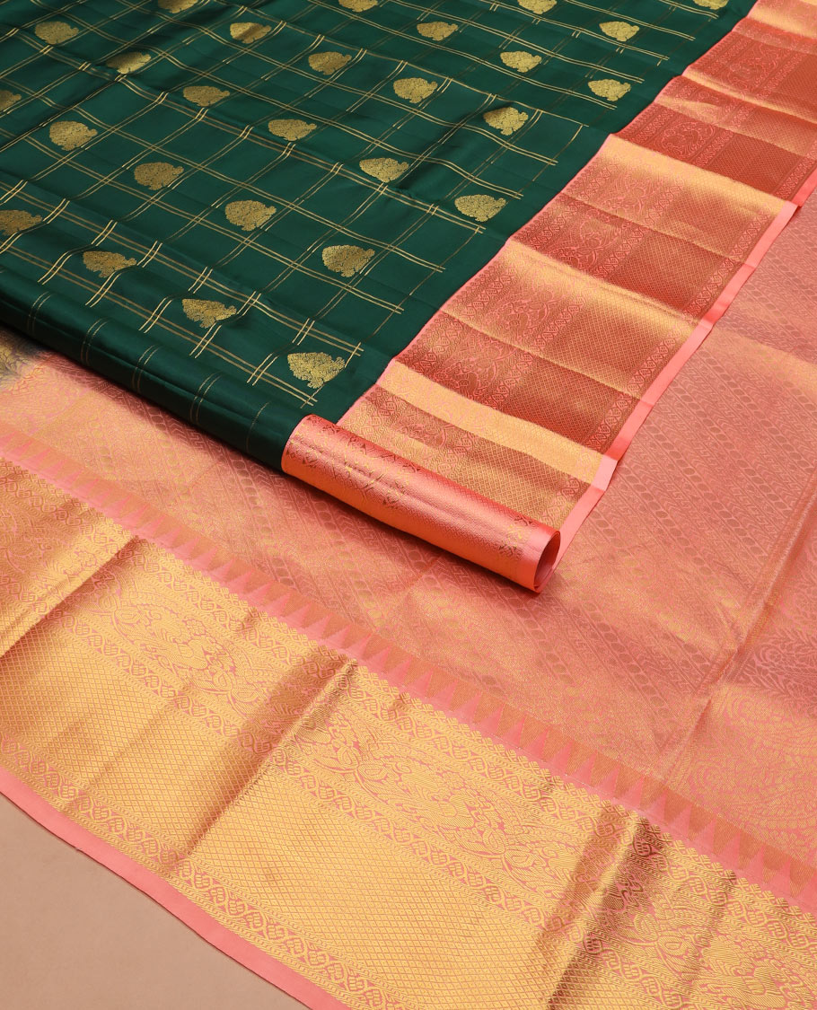 Green butta enclosed zari checked silk saree, contrast temple border of thilakam mokku, muthu, kodi visiry, mayil, and mayil kann designs, and geometric patterned pallu