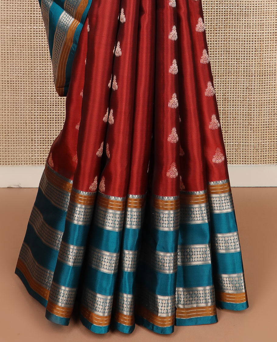 Rust zari buttas silk saree, contrast border of manga mokku,muthu,kathir & rudraksham motifs & geometric patterned pallu